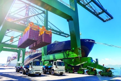 Crane unloading two containers