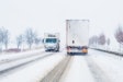Freight Transportation Truck On The Road In Snow Storm Blizzard,