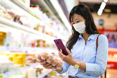 Chinese Consumer Examining Eggs