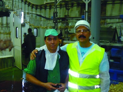 Workers In Poultry Processing Plant