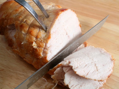 Boneless Turkey Breast Being Carved