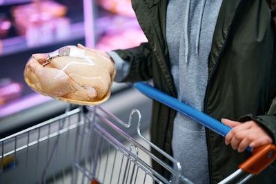 Choosing Chicken In Supermarket