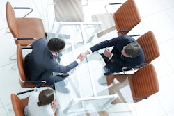 Handshake Across Table