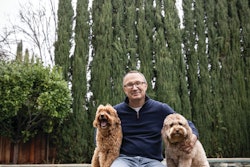Primal Pet Group CEO Jon Balousek (here with Labradoodle Buster and Goldendoodle Beau) is at the helm of two brands sitting at the top of their respective segments in terms of longevity and innovation.