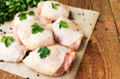 Raw Chicken Thighs On Parchment