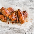 Baked Chicken Wings On Wooden Table
