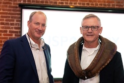 Clint Rivers being “collared” by Mikell Fries, president of Claxton Poultry Farms, and outgoing USPOULTRY chair.