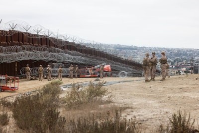 U.S. Marines install concertina wire along the southern border wall near San Ysidro, California, USA.