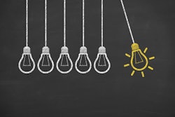 Idea Light Bulb Concept On Blackboard