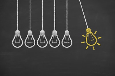 Idea Light Bulb Concept On Blackboard
