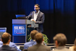 Speaker presenting at Feed Mill the Future Conference podium