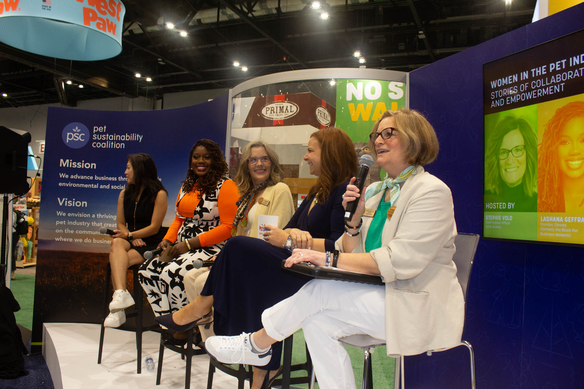 Women panelists speaking at a Pet Sustainability Coalition 'Women in the Pet Industry' event at a trade show
