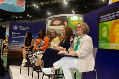 Women panelists speaking at a Pet Sustainability Coalition 'Women in the Pet Industry' event at a trade show