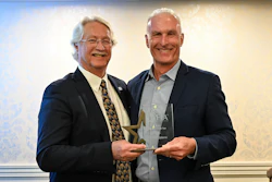 Mike Osborne (left) is presented with the AFIA Member of the Year Award by Dan Meagher, AFIA 2025–26 Board Chair.