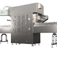 Industrial food processing machine with stainless steel construction, conveyor belts, and digital control panel