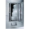 Open electrical enclosure with multiple circuit breakers mounted on corrugated metal wall