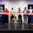 Purina ribbon-cutting ceremony with executives and officials at corporate event