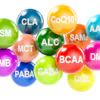 Colorful spheres displaying supplement and amino acid abbreviations including BCAA, GABA, CoQ10, and others for fitness and wellness reference