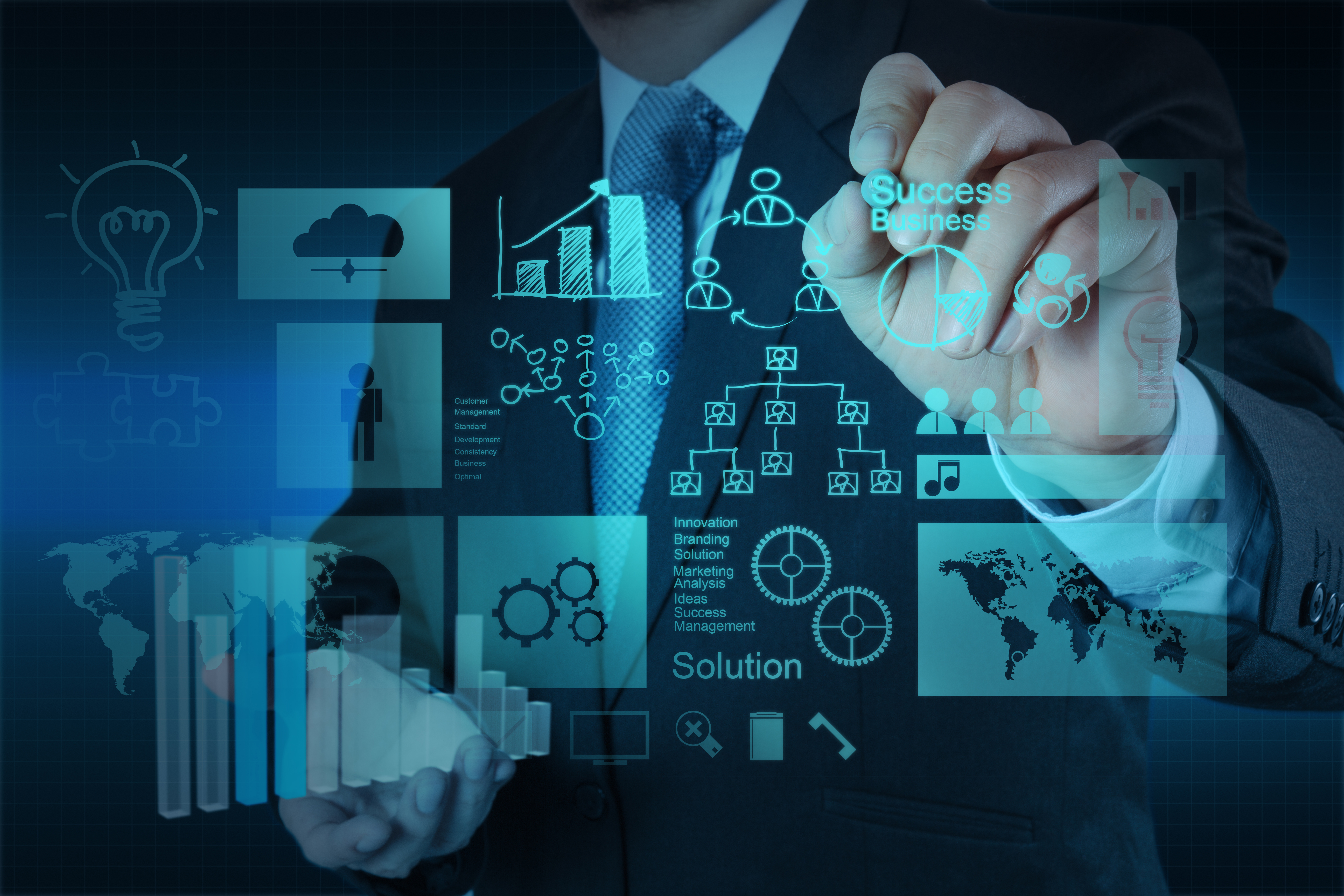 Businessman drawing digital business strategy with analytics charts, network diagrams, and global connectivity icons on blue interface