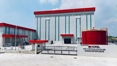 Norel Nutrition Malaysia manufacturing facility with red-roofed industrial building and white corrugated walls